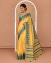 Yellow small thread buttas linen cotton saree, contrast temple zari piping border, striped pallu and a contrast blouse