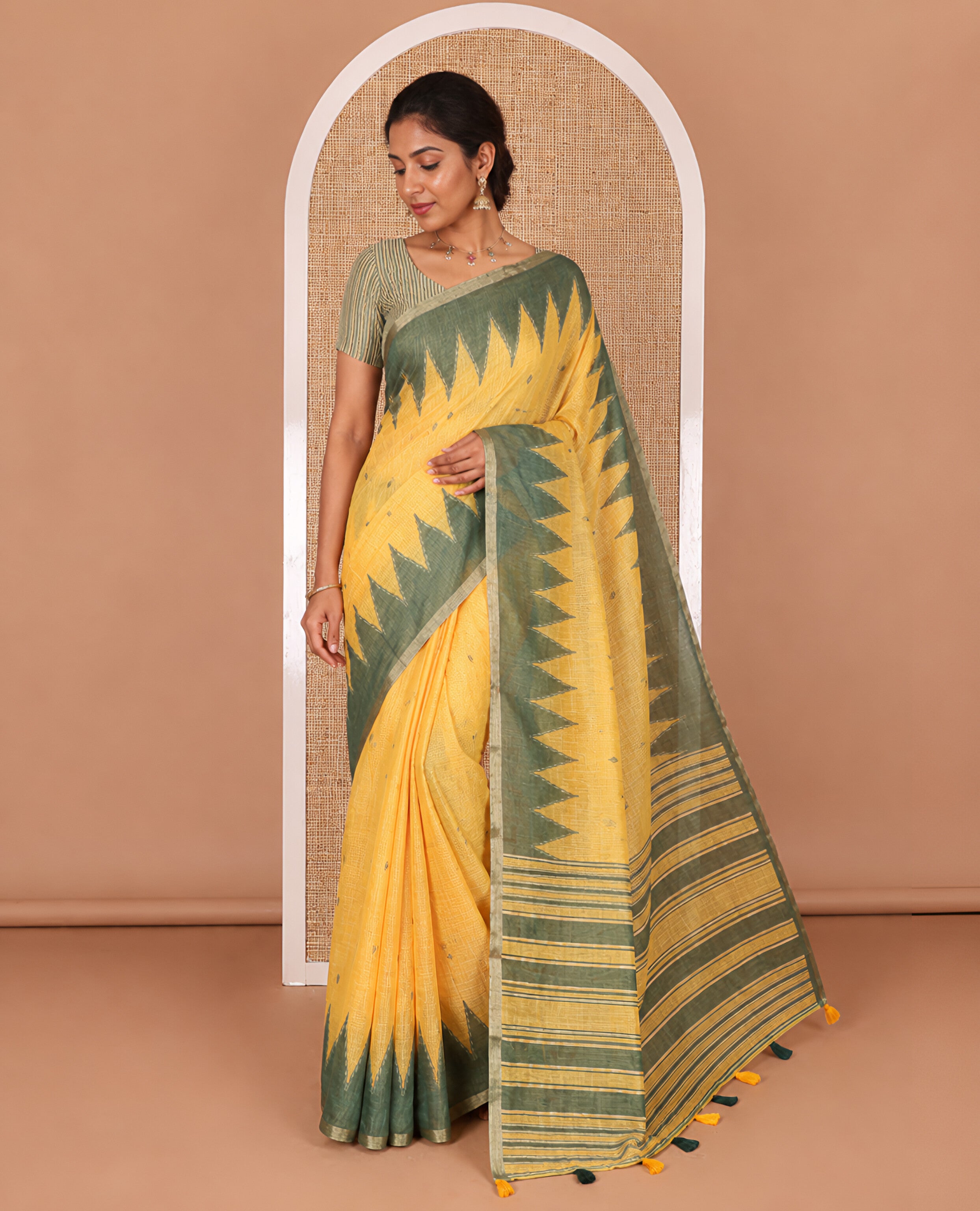 Yellow small thread buttas linen cotton saree, contrast temple zari piping border, striped pallu and a contrast blouse