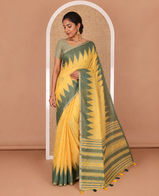 Yellow small thread buttas linen cotton saree, contrast temple zari piping border, striped pallu and a contrast blouse