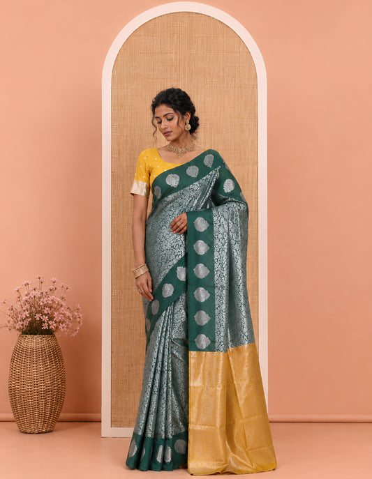 Bottle Green Art Kanchi Silk Saree Features Jacquard Design, a Zari-Motif Border, Contrast Intricate Pallu, and a Contrast Blouse
