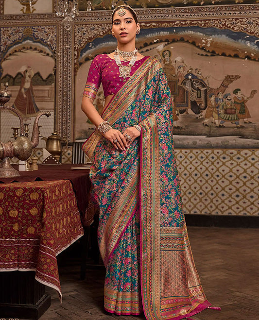 Blue Designer Saree, Impeccably Styled with Meenakari-Style Floral Designs All Over Its Body, Complemented by a Contrast Meenakari-Style Colorful Border, Intricately Designed Pallu, and Paired with a Contrast Blouse