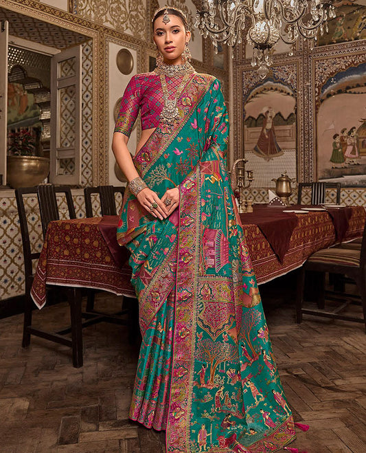 Green Designer Saree, Enthralled with Village-Theme Designs All Over Its Body, Complemented by a Contrast Colorful Meenakari Mughal-Style Border, Artfully Detailed Pallu, and Paired with a Contrast Blouse