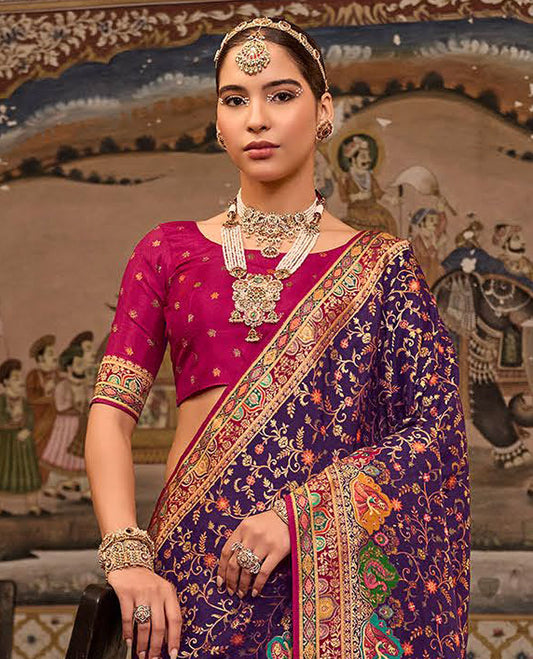 Violet Designer Saree, Artfully Detailed with Floral Vine Designs All Over Its Body, Complemented by a Contrast Border of Peacock and Mughal-Style Human Motifs, Pallu of Meenakari-Style Mughal Designs, and Paired with a Contrast Blouse