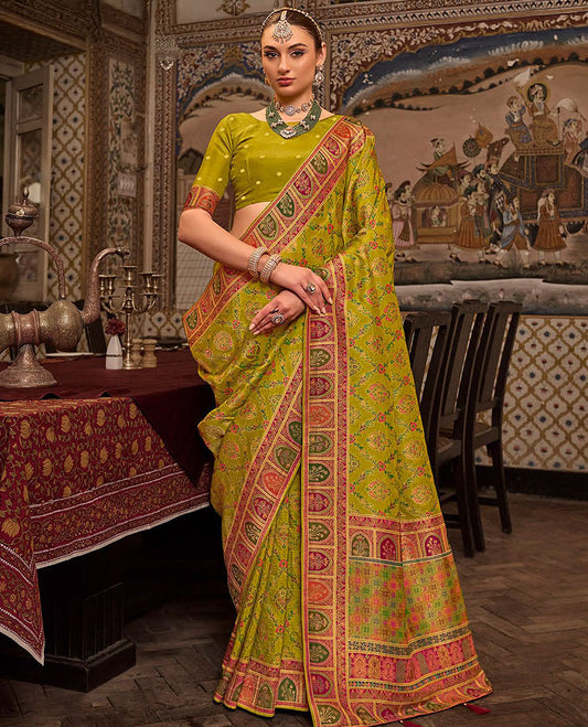 Green Designer Saree, Embellished with Meenakari-Style Floral-Jaal Design All Over Its Body, Complemented by a Contrast Mughal-Style Border, Meticulously Meenakari Designs Crafted Pallu, and Paired with a Contrast Blouse