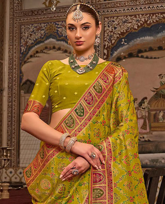 Green Designer Saree, Embellished with Meenakari-Style Floral-Jaal Design All Over Its Body, Complemented by a Contrast Mughal-Style Border, Meticulously Meenakari Designs Crafted Pallu, and Paired with a Contrast Blouse