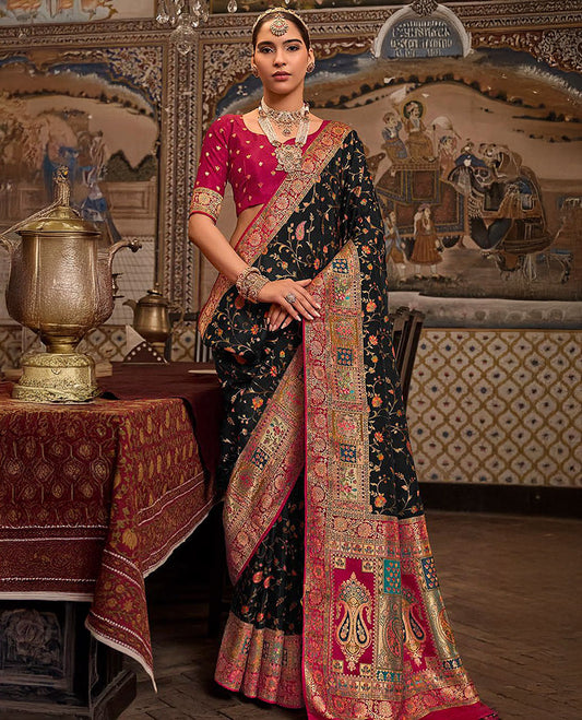Black Designer Saree, Beautifully Bedecked with Meenakari-Style Floral-Jaal Design All Over Its Body, Complemented by a Contrast Mughal-Style Border, Meticulously Meenakari Designs Crafted Pallu, and Paired with a Contrast Blouse