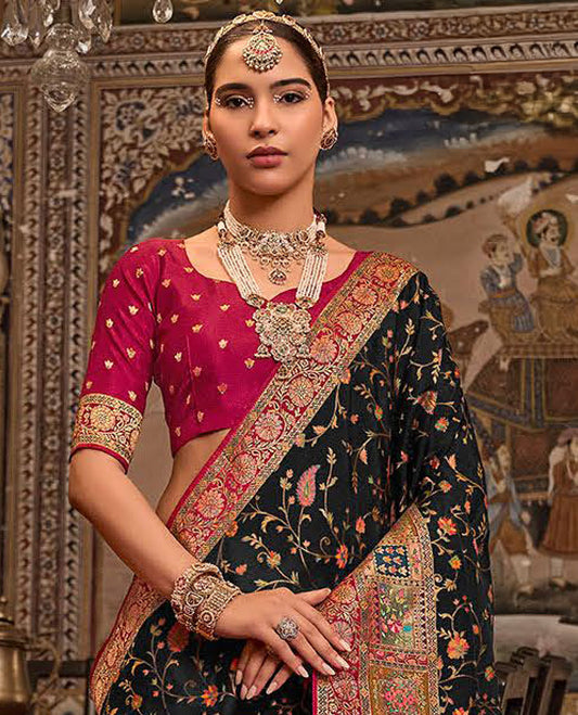 Black Designer Saree, Beautifully Bedecked with Meenakari-Style Floral-Jaal Design All Over Its Body, Complemented by a Contrast Mughal-Style Border, Meticulously Meenakari Designs Crafted Pallu, and Paired with a Contrast Blouse