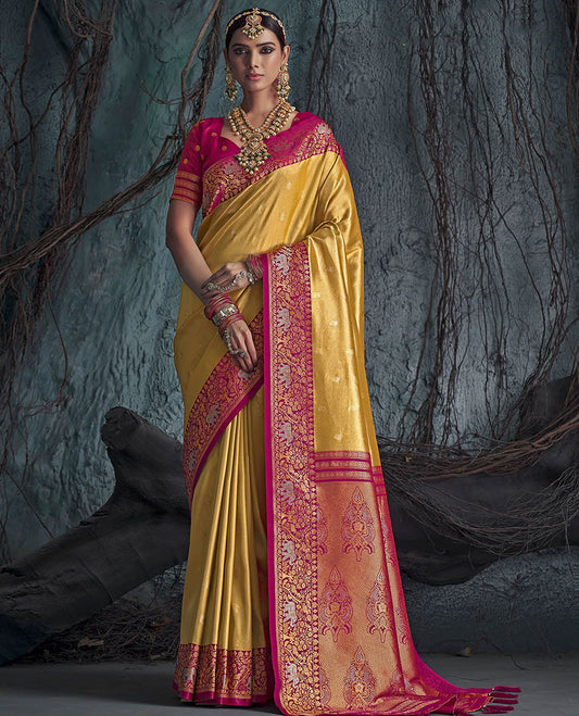 Gold Designer Saree, Subtly Sparkled with Buttas All Over Its Body, Complemented by a Contrast Floral and Elephant Border, Pallu of Intricate Designs, and Paired with a Contrast Blouse