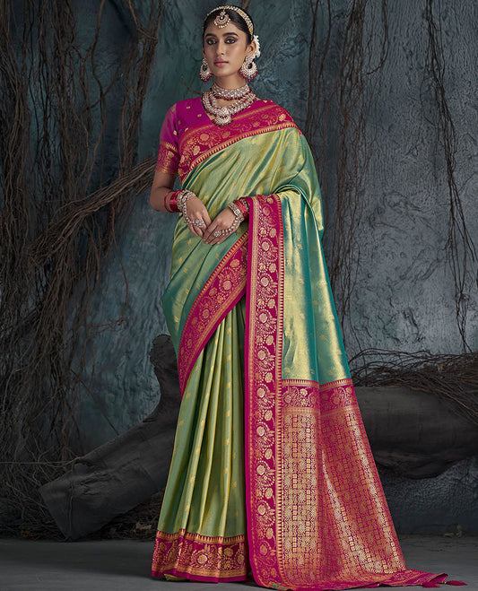 Green Designer Saree, Subtly Sparkled with Buttas All Over Its Body, Complemented by a Contrast Floral Creeper Border, Pallu of Intricate Designs, and Paired with a Contrast Blouse