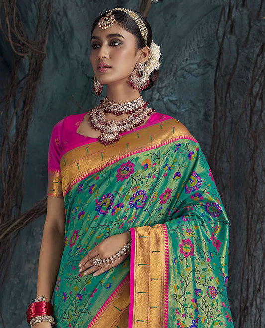 Green Designer Saree, Prettified with Paithani-Style Floral Vine and Peacock Designs All Over Its Body, Complemented by a Contrast Temple Muniya Border, Pallu of Floral Jaal Designs, and Paired with a Contrast Blouse