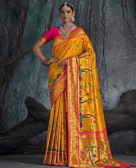 Yellow Designer Saree, Beautified with Colorful Buttas All Over Its Body, Complemented by a Contrast Temple Muniya Border, Pallu of Meenakari-Style Flora-Fauna Designs, and Paired with a Contrast Blouse