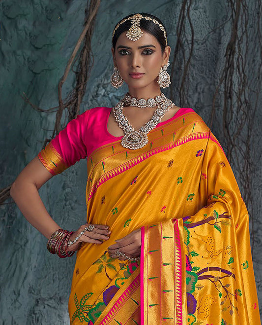 Yellow Designer Saree, Beautified with Colorful Buttas All Over Its Body, Complemented by a Contrast Temple Muniya Border, Pallu of Meenakari-Style Flora-Fauna Designs, and Paired with a Contrast Blouse