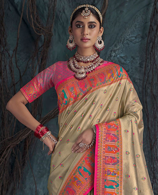 Light Sandal Designer Saree, Subtly Sparkled with Meena Buttas All Over Its Body, Complemented by a Contrast Mughal-Style Human Motifs Border, Pallu of Mughal-Style Designs, and Paired with a Contrast Blouse
