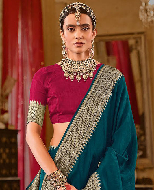 Teal Blue Sparsely Textured Designer Saree, Decorated with Traditional Zari Design Border, Pallu Features Paisley Designs, and Paired with a Contrast Blouse