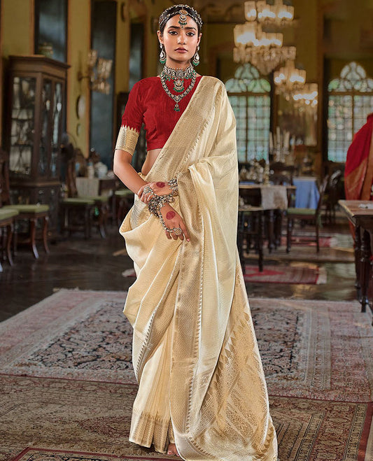 Cream Sparsely Textured Designer Saree, Enthralled with Traditional Zari Design Border, Pallu Features Paisley Designs, and Paired with a Contrast Blouse