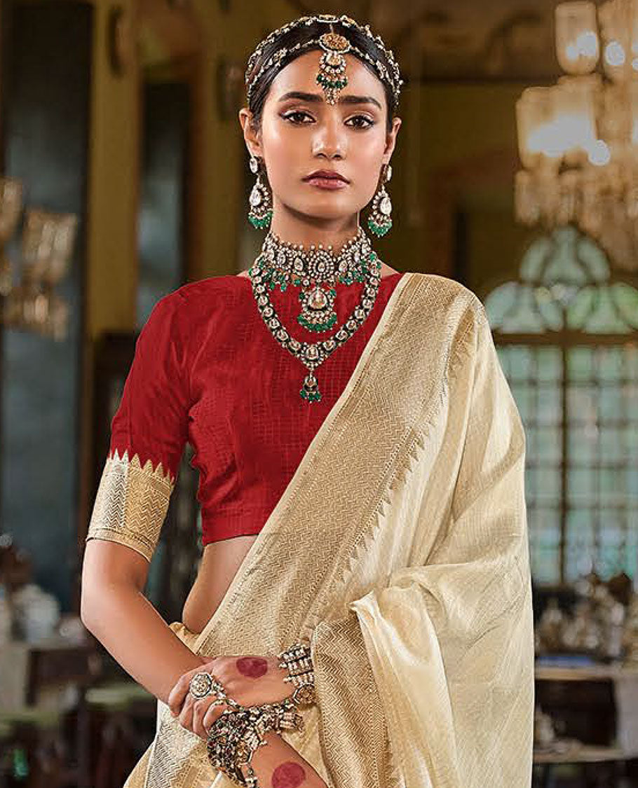 Cream Sparsely Textured Designer Saree, Enthralled with Traditional Zari Design Border, Pallu Features Paisley Designs, and Paired with a Contrast Blouse