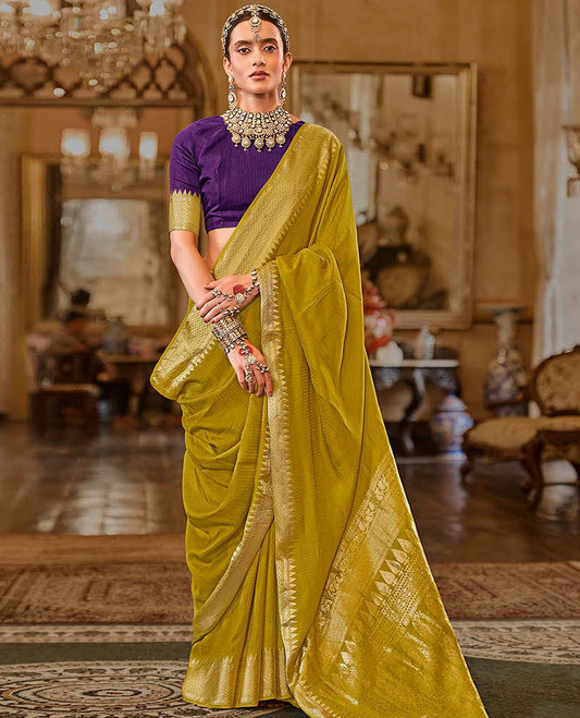 Green Sparsely Textured Designer Saree, Adorned with Traditional Zari Design Border, Pallu Features Paisley Designs, and Paired with a Contrast Blouse