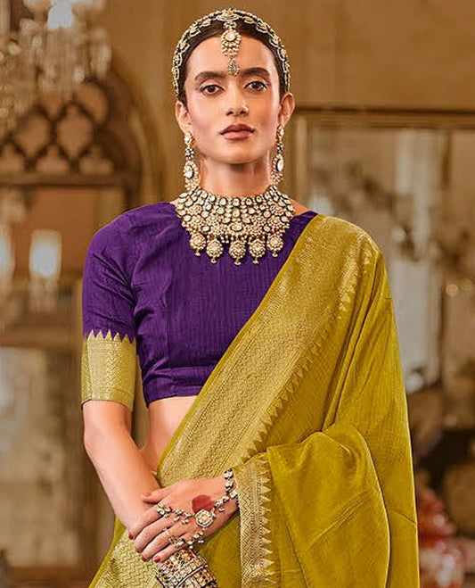 Green Sparsely Textured Designer Saree, Adorned with Traditional Zari Design Border, Pallu Features Paisley Designs, and Paired with a Contrast Blouse