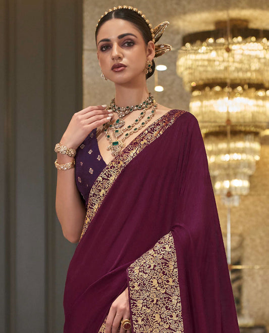 Maroon plain designer saree, self-border, and animal motifs woven pallu