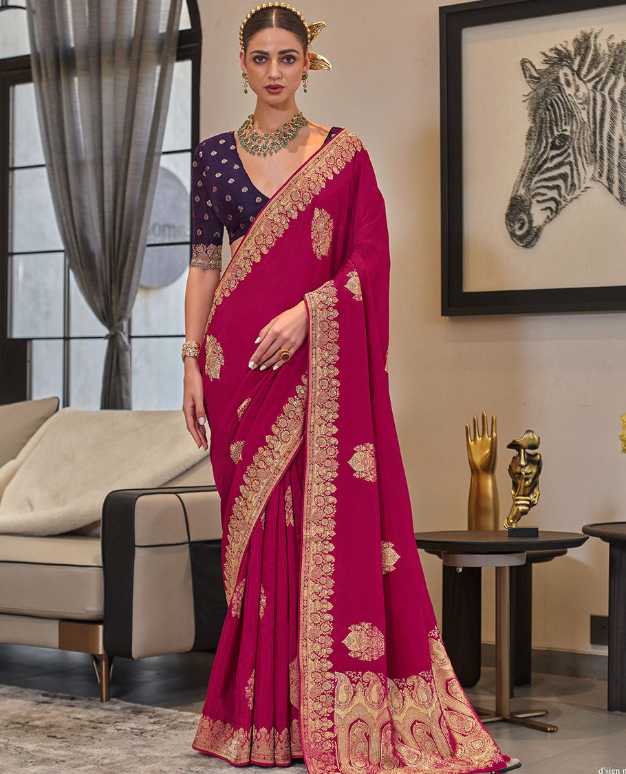 Magenta buttas designer saree, intricate border, and pallu of paisley designs