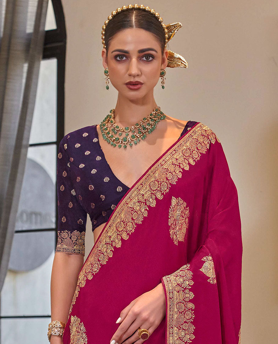 Magenta buttas designer saree, intricate border, and pallu of paisley designs