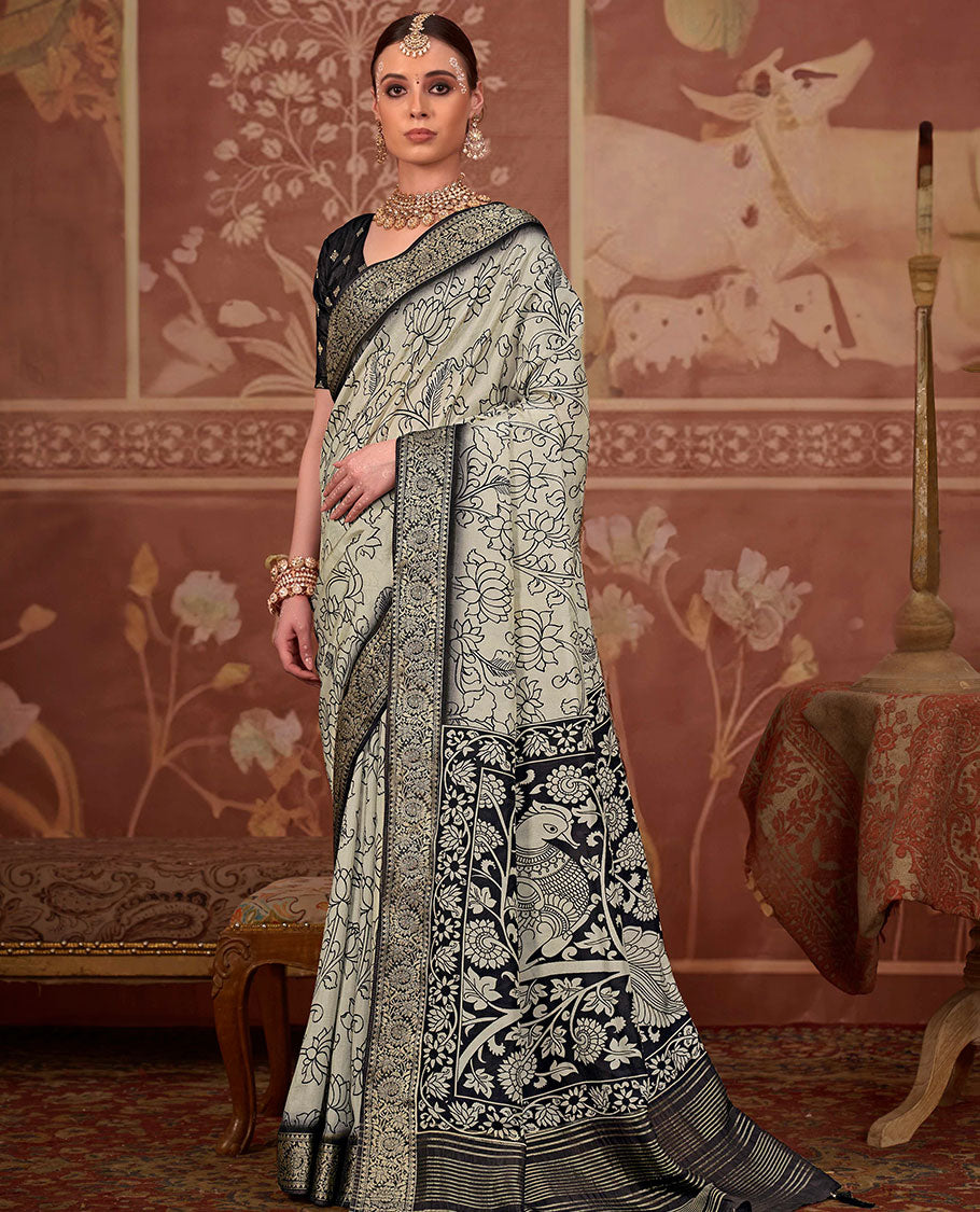 Beige kalamkari lotus printed designer saree, contrast zari border, and kalamkari floral-peacock printed pallu