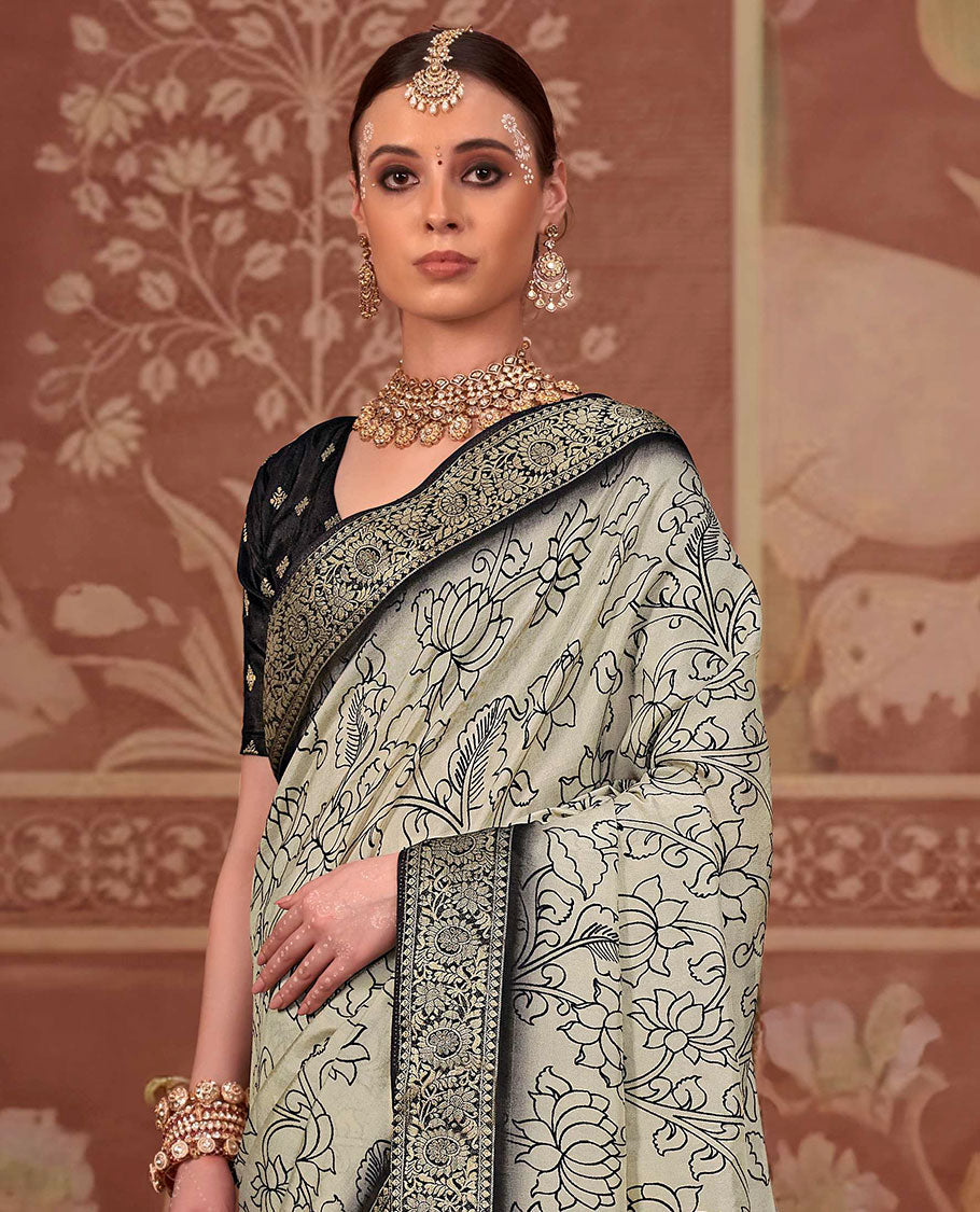 Beige kalamkari lotus printed designer saree, contrast zari border, and kalamkari floral-peacock printed pallu