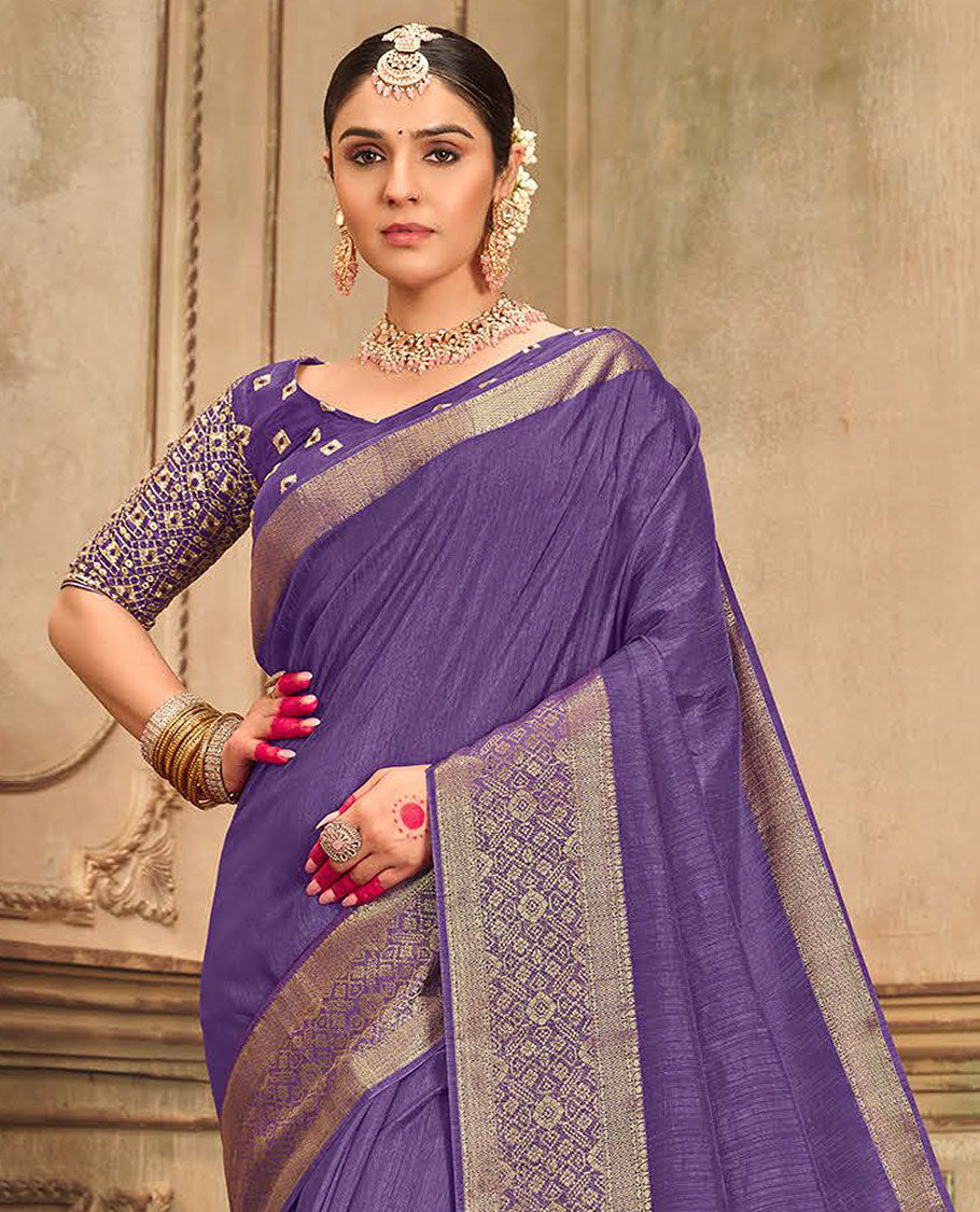 Violet plain designer saree, patola-style motifs woven border, and zari striped pallu