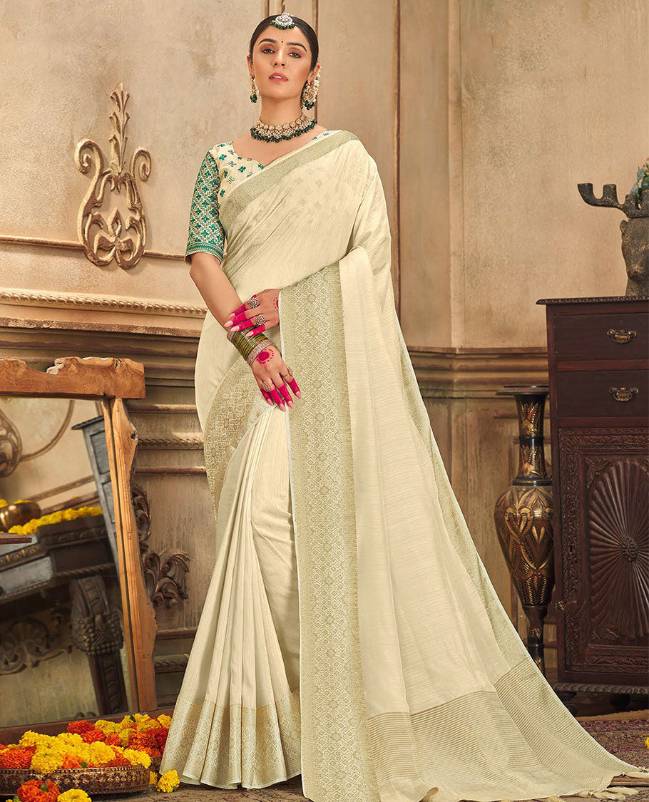 Cream plain designer saree, patola-style motifs woven border, and zari striped pallu