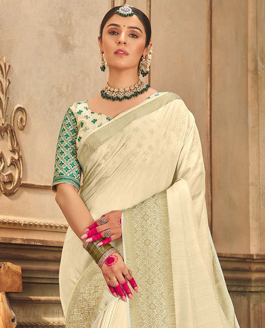 Cream plain designer saree, patola-style motifs woven border, and zari striped pallu