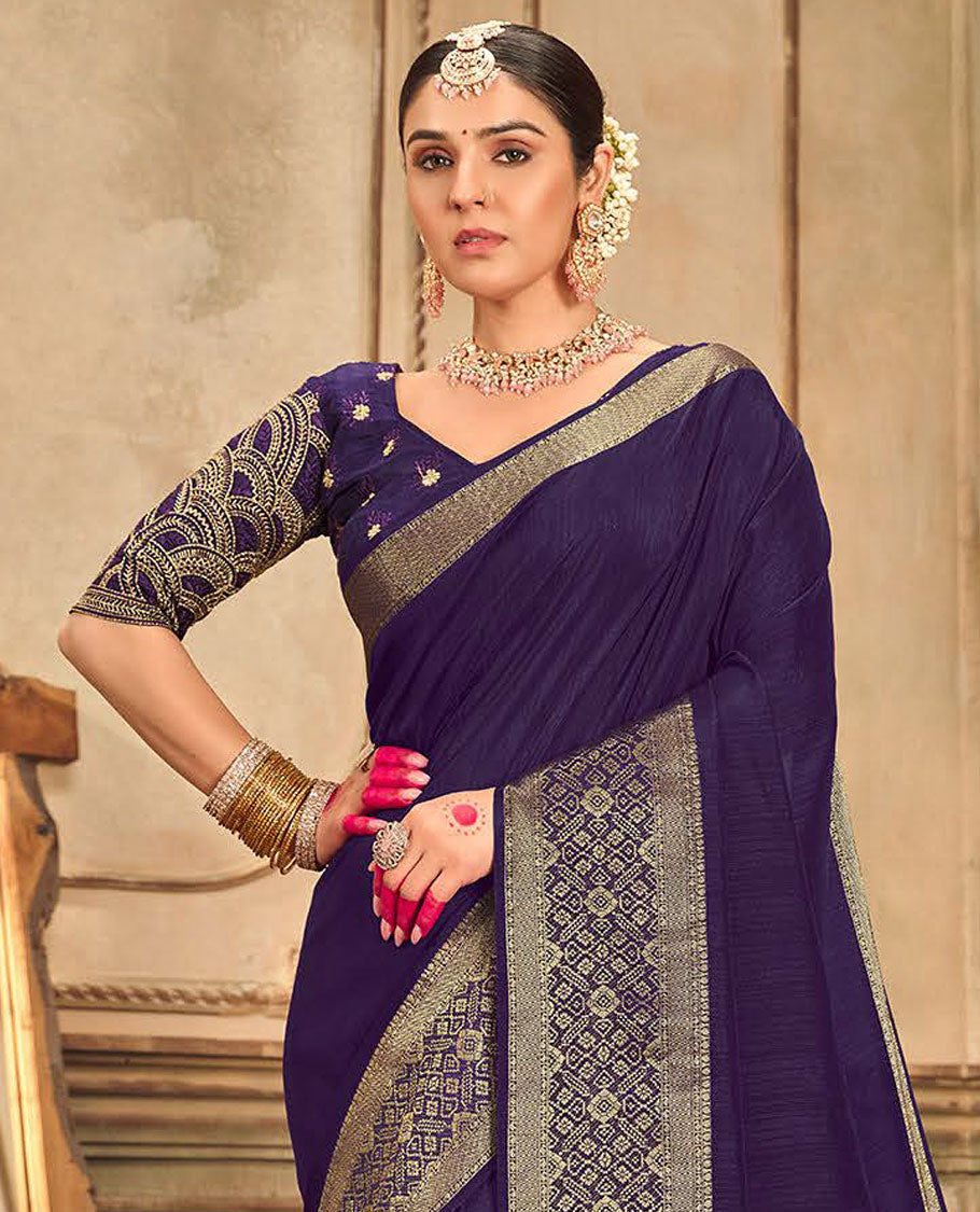 Blue plain designer saree, patola-style motifs woven border, and zari striped pallu