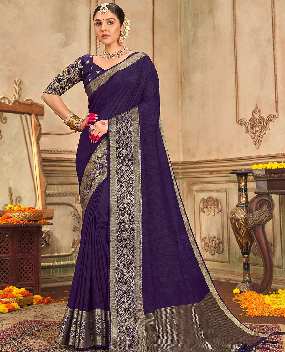 Blue plain designer saree, patola-style motifs woven border, and zari striped pallu