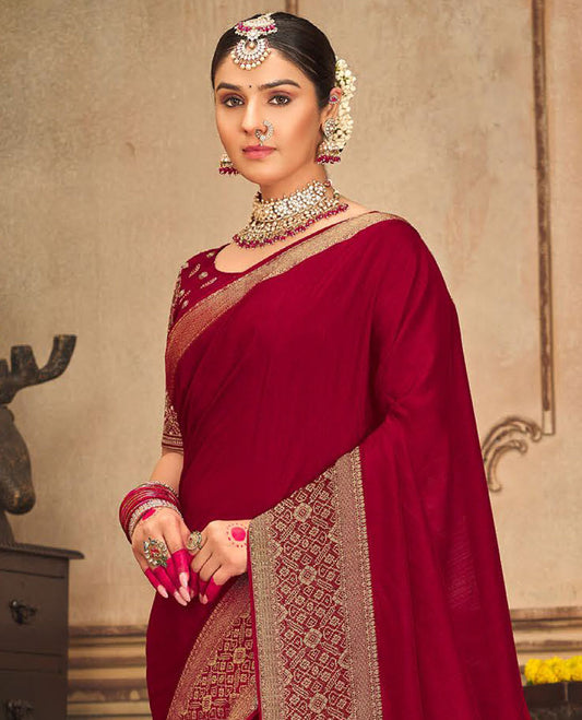 Red plain designer saree, patola-style motifs woven border, and zari striped pallu