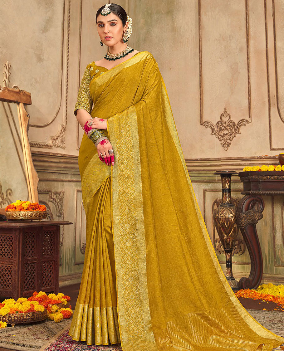 Mustard plain designer saree, patola-style motifs woven border, and zari striped pallu