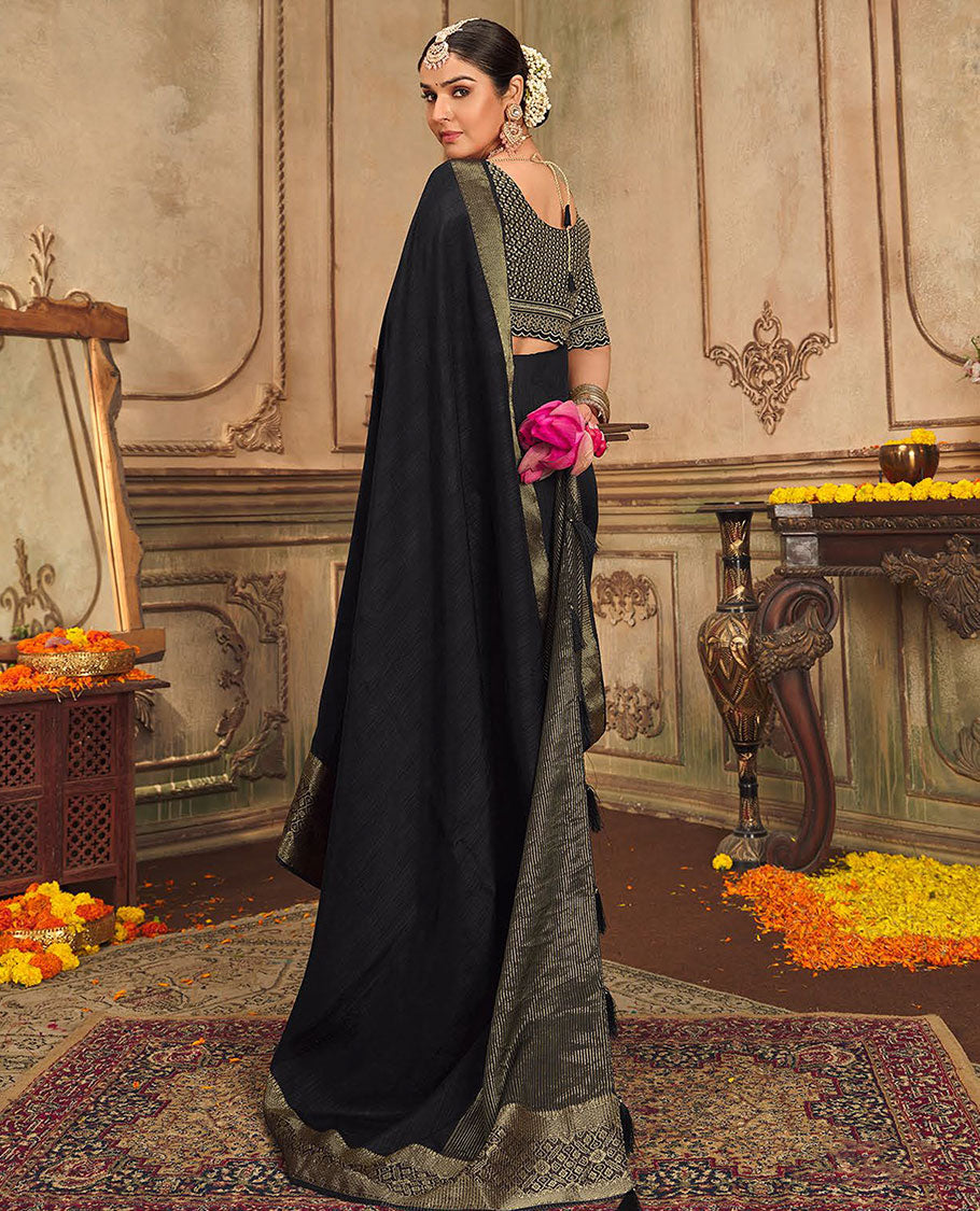 Black plain designer saree, patola-style motifs woven border, and zari striped pallu