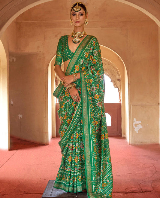 Green double-ikkat patola printed designer catalog saree, stone work border, and patola patterned pallu