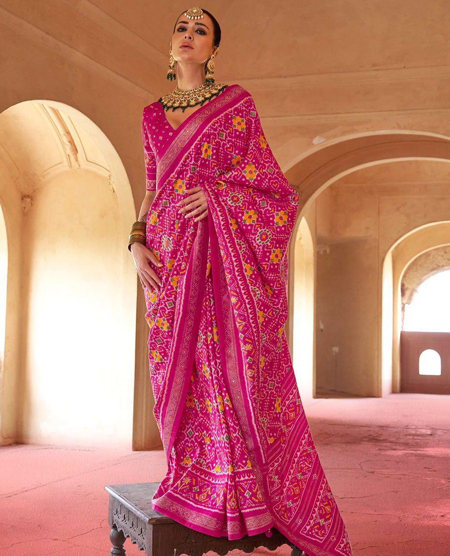Rani pink double-ikkat patola printed designer catalog saree, stone work border, and patola patterned pallu