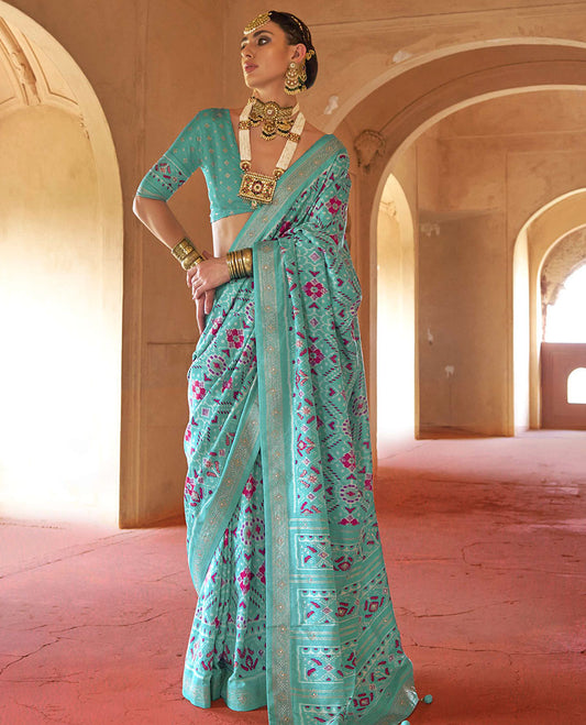 Turquoise double-ikkat patola printed designer catalog saree, stone work border, and patola patterned pallu