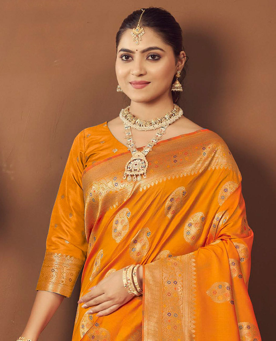 Orange Banaras Designer Catalog Saree, Ornamented with Paisley Meena Buttas, Highlighted by a Traditional Meenakari Border, Grand Pallu, and a Matching Blouse