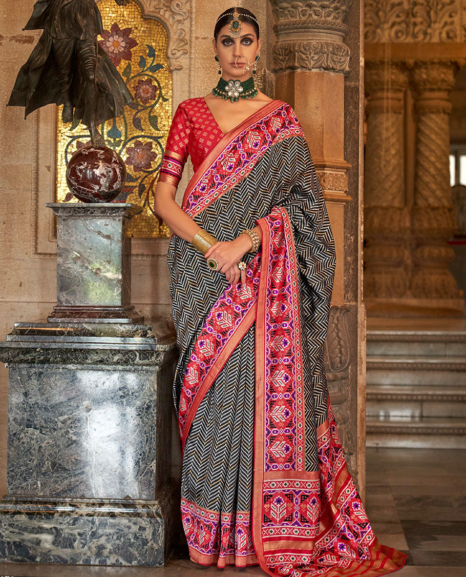 Black chevron stripes designer catalog saree, contrast patola design border, and patola printed pallu