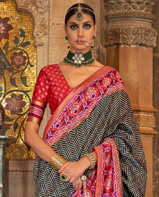 Black chevron stripes designer catalog saree, contrast patola design border, and patola printed pallu