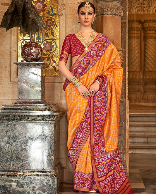 Orange chevron stripes designer catalog saree, contrast patola design border, and patola printed pallu