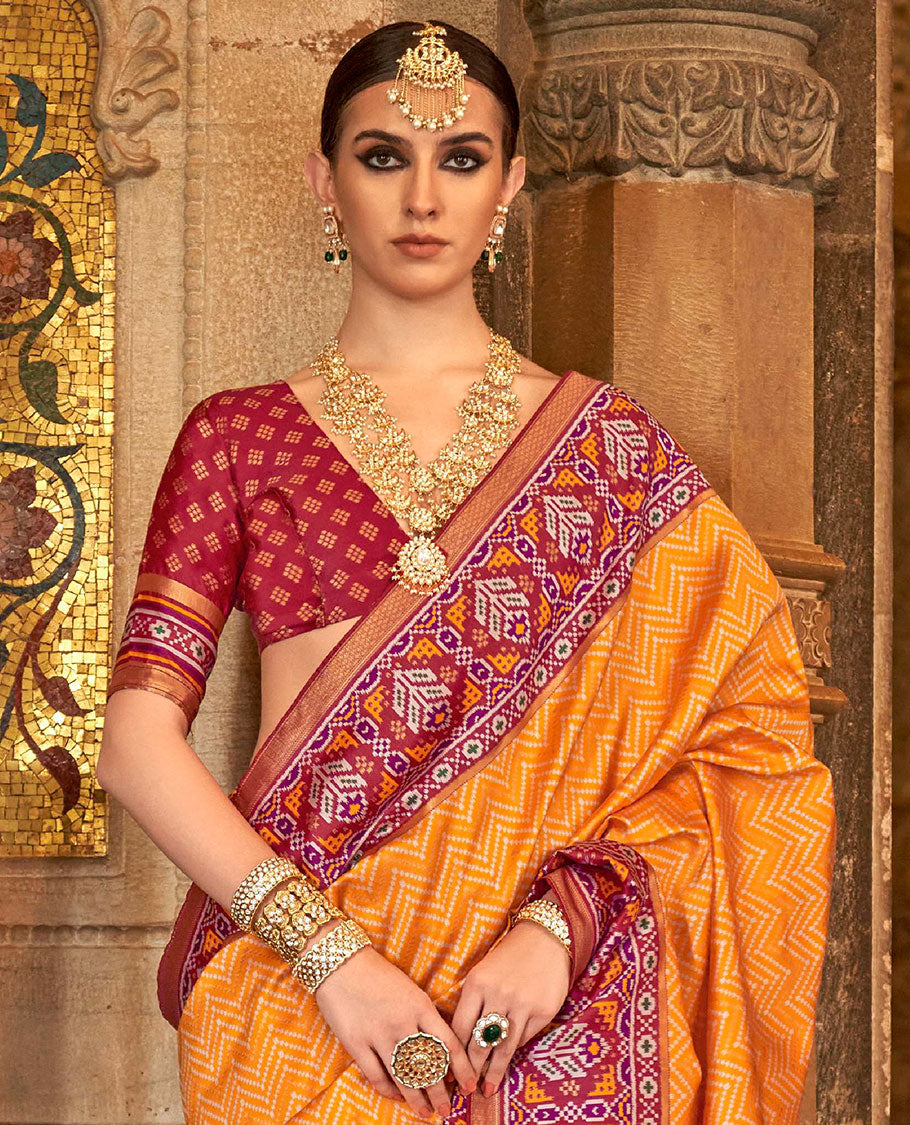 Orange chevron stripes designer catalog saree, contrast patola design border, and patola printed pallu