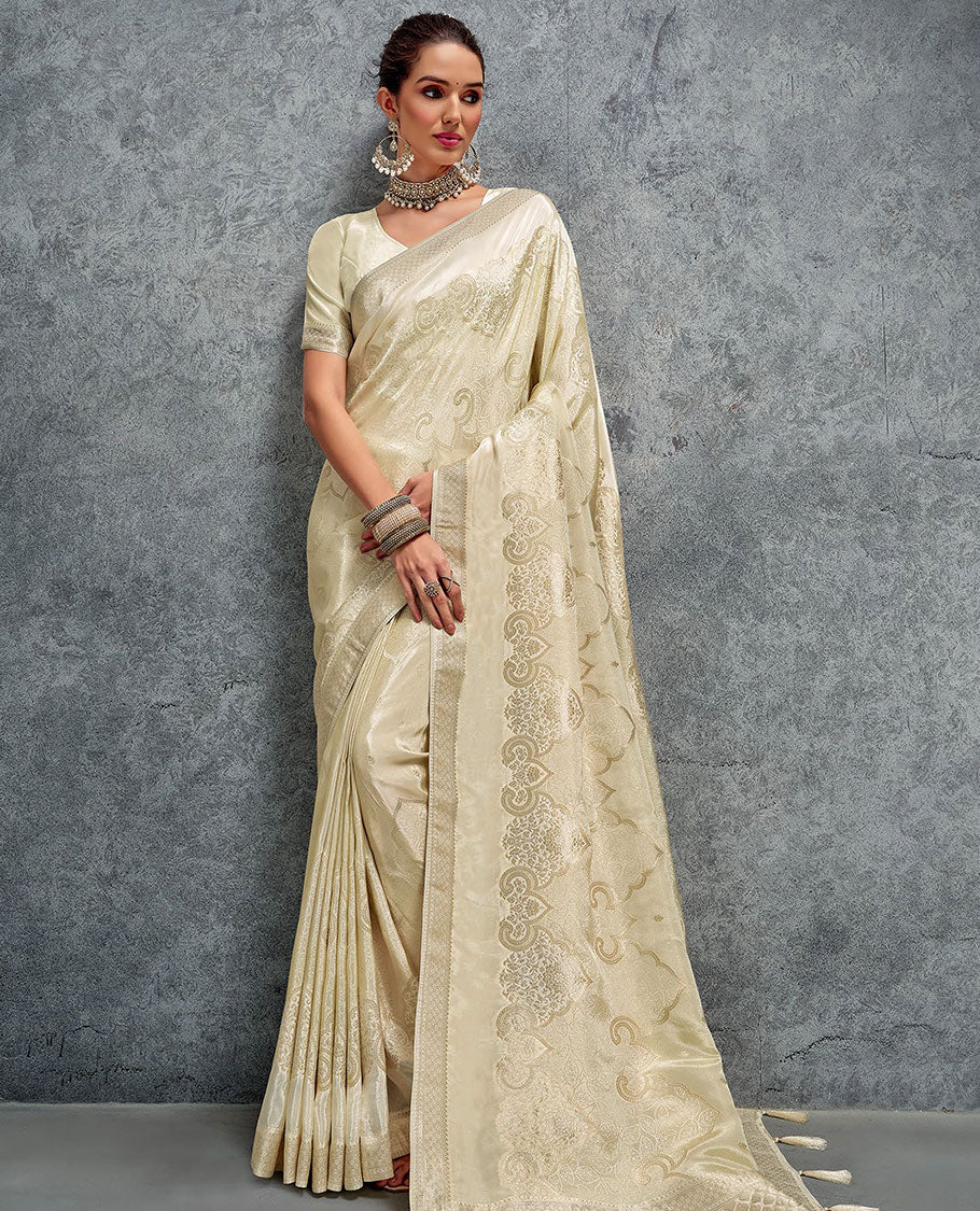 Cream jacquard designer saree, zari border, and pallu of intricate design