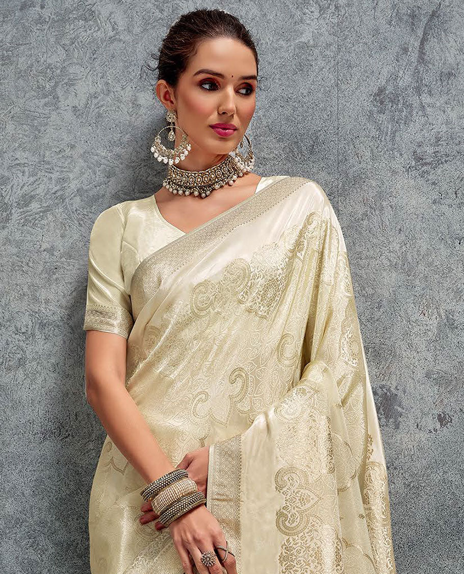 Cream jacquard designer saree, zari border, and pallu of intricate design