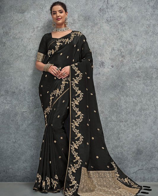 Black buttas designer saree, floral creeper and bird border, and intricate pallu