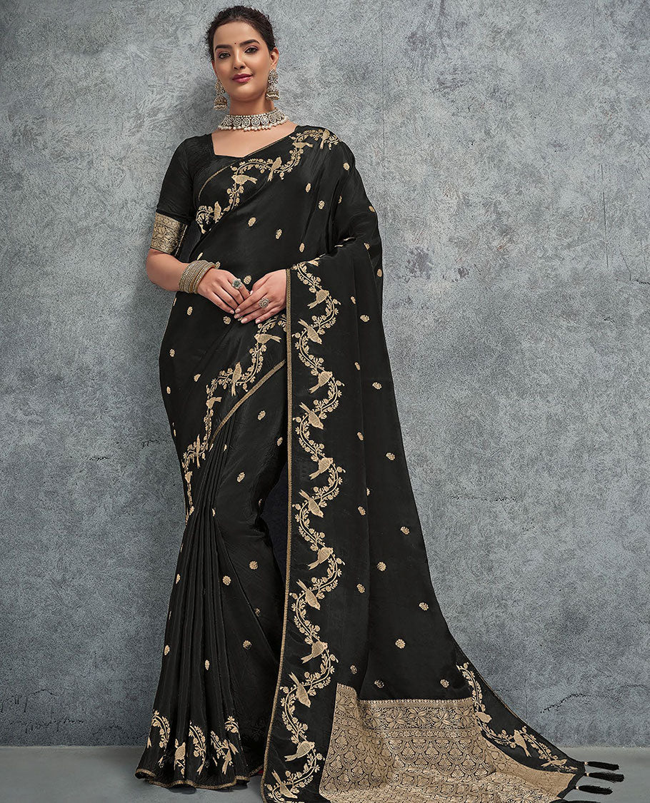 Black buttas designer saree, floral creeper and bird border, and intricate pallu