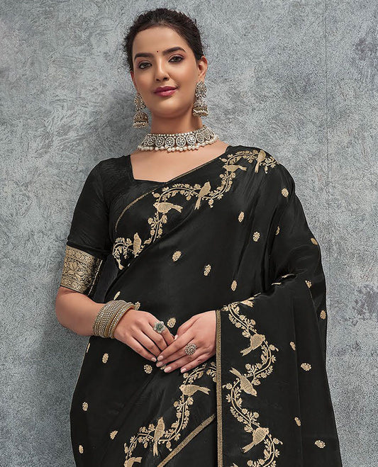 Black buttas designer saree, floral creeper and bird border, and intricate pallu