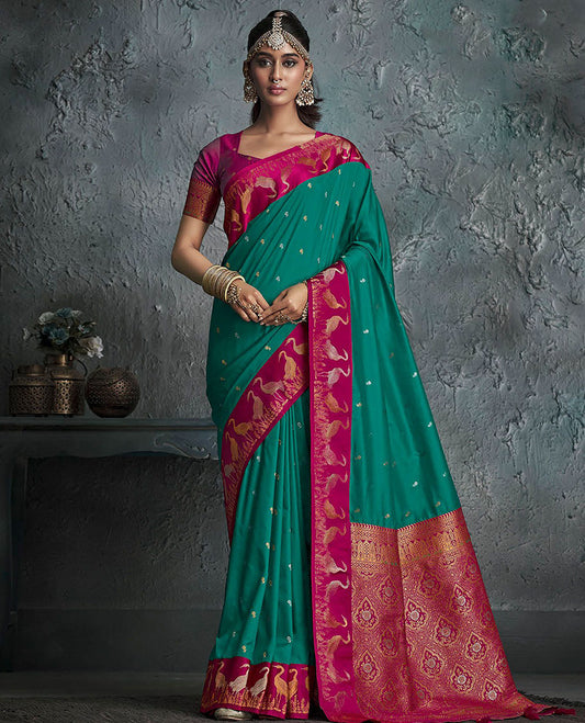 Green Designer Saree, Embellished with Buttas on Its Body, Complemented by a Contrast Border of Crane Motifs, Pallu of Intricate Zari Designs, and Paired with a Contrast Blouse