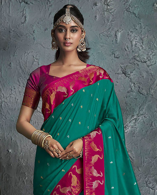 Green Designer Saree, Embellished with Buttas on Its Body, Complemented by a Contrast Border of Crane Motifs, Pallu of Intricate Zari Designs, and Paired with a Contrast Blouse